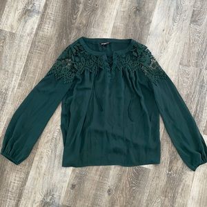 Emerald green blouse with lace cutouts